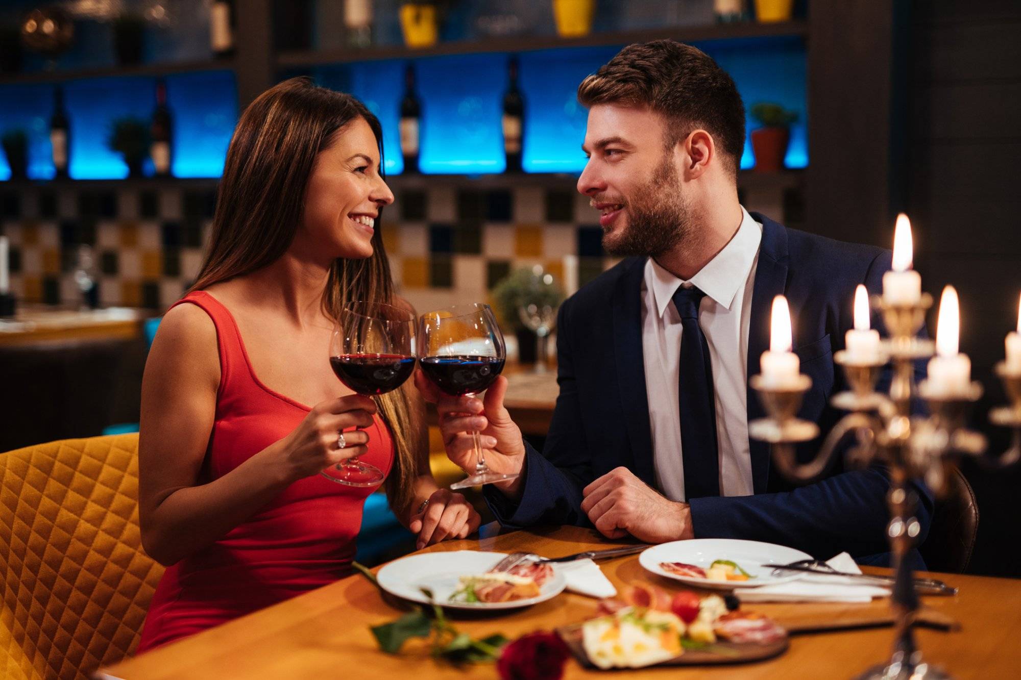 Couple enjoying red wine on Valentine’s Day Couple enjoying red wine on Valentine's Day