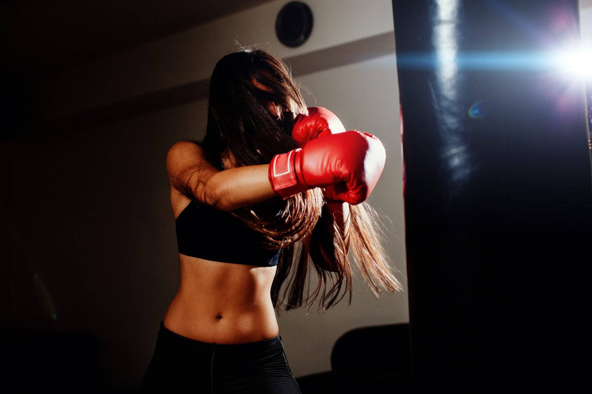 sexy fighter girl punching actively